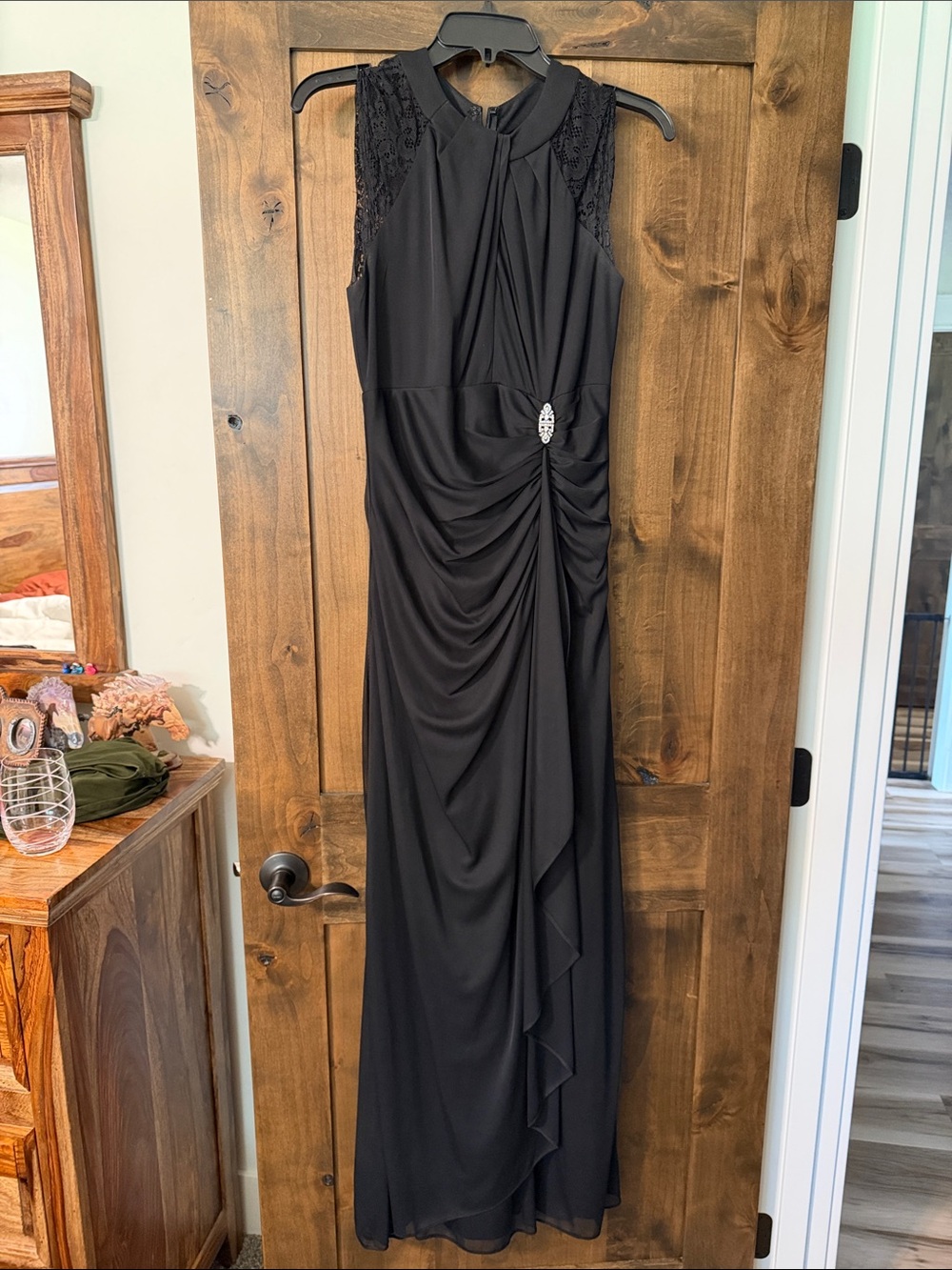 Elegant Black Sleeveless Maxi Dress with Side Brooch Detail